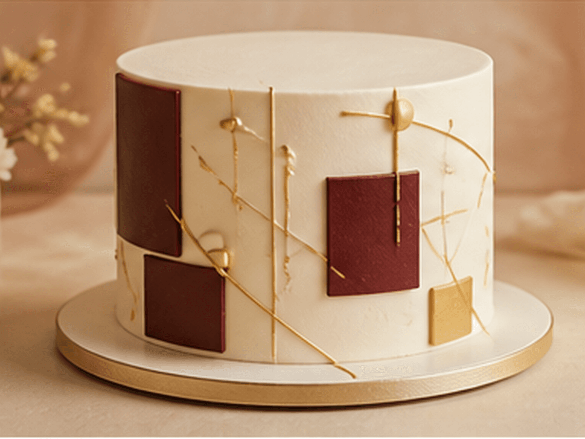 Bespoke art-panel cake in burgundy and gold by PhiBakes